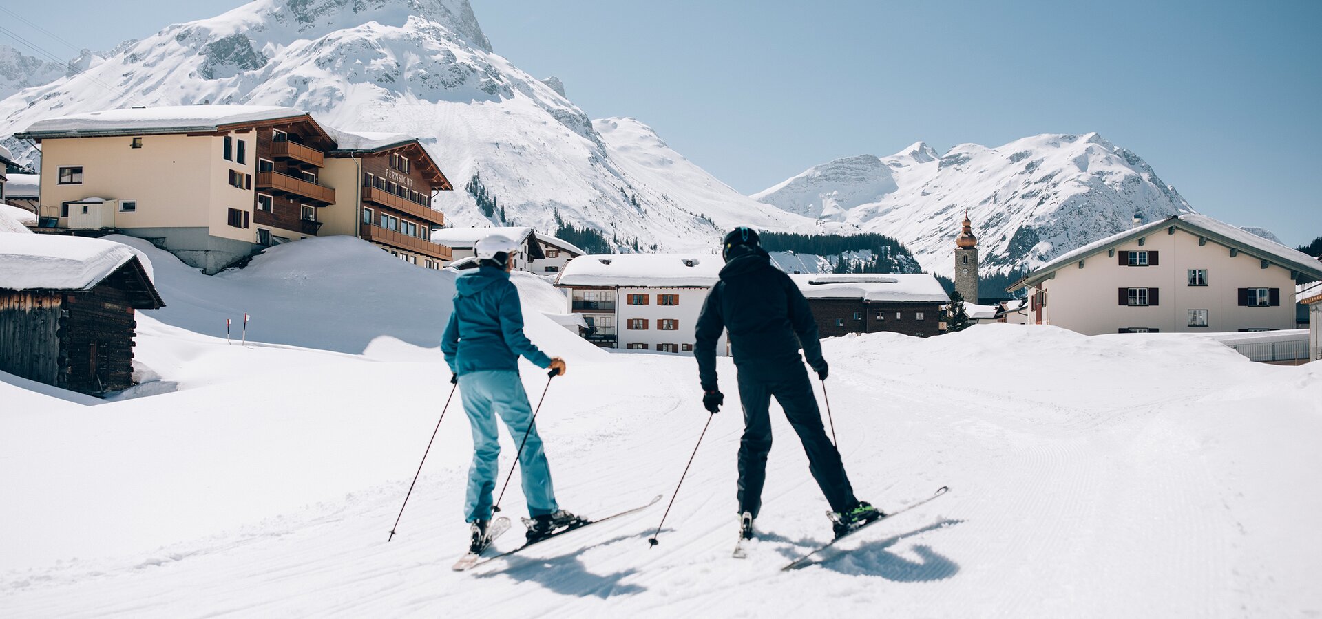 couple on skiing holiday in Lech | © Daniel Zangerl / Lech Zuers Tourismus